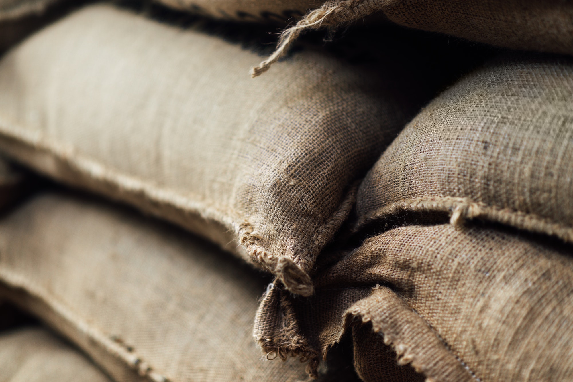 stack of full burlap bags in stock